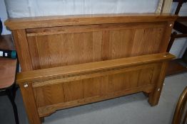 A modern golden oak double bed frame and Myers mattress