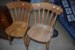A pair of beech frame kitchen chairs