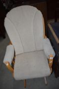 A modern beech frame slide action rocker chair