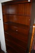 A modern mahogany effect tall bookshelf
