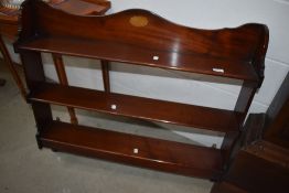 An Edwardian mahogany wall shelf