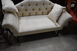 A reproduction bedroom settee of small proportions