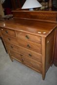 An early 20th Century mahogany bedroom chest having two over two drawers, with cupboard to base