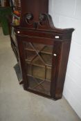 A 19th Century mahogany corner display cabinet having astral glazed door and line inlay decoration