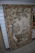 A tapestry style wall hanging having goat and goose decoration, on brass rail