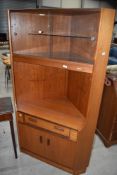 A vintage teak G plan corner display with drawer and double cupboard under