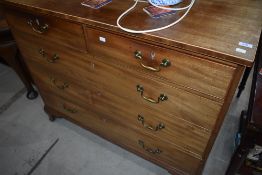 A 19th Century bleached mahogany chest of two over three drawers with brass drop handles , some