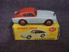 A Dinky diecast, 167 A.C.Aceca Coupe in grey with red roof and tailgate and red hubs, in original