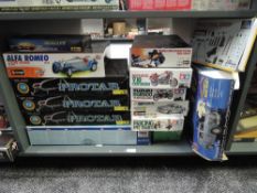 A collection of Thirteen mixed scale plastic and metal kits including Protar 1:9 Motorcycles x3,