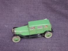 A 1930's Chad Valley clockwork and tinplate saloon car in green with black guards and silver