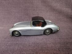 A 1960's Bandai tinplate and friction driven Austin Healey Hardtop in Light Blue with black roof