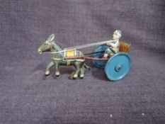 A Gama DRGM Germany tinplate and clockwork Donkey with Cart and Clown