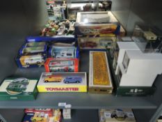 A shelf of modern Corgi diecasts including Transport of the 30's, British Motoring Classics of the