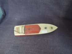 A 1930's Hornby tinplate and clockwork 13' Swift Speedboat in red and cream