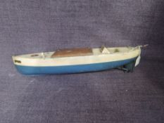 A 1930's Sutcliffe clockwork and tinplate 16' Meteor Speed Boat in blue and c ream