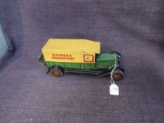 A 1930's Well Toys tinplate and clockwork Express Transport Van in green and yellow, number plate