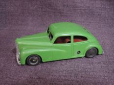 A 1950's Mettoy clockwork and tinplate MTY 810 Streamline Saloon Car in green with red interior