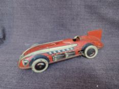 A 1930's Wells Toys tinplate and clockwork Racing Record Car in red, missing driver
