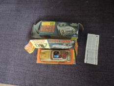 A Corgi diecast, 261 James Bond's 007 Aston Martin DB5 on inner card display stand with driver and