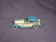 A 1930's Wells clockwork and tinplate Rolls Royce Sedan Car in blue and cream, clockwork af