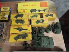 Fourteen Dinky Military diecasts, 697 25-Pounder Field Gun Set, 621 3-Ton Army Wagon, 623 Army