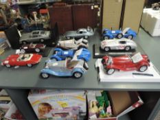 Ten Burago, Maisto and similar plastic and diecast scale model Vintage Cars and Racing Cars