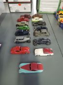 Fifteen Dinky and Timpo playworn Saloon Cars including 157 Jaguar in red and in pink & turquoise ,