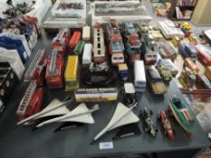 A collection of playworn diecasts including Corgi Car Transporters, Dinky Fire Engines, Corgi