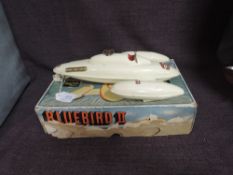A 1950s Sutcliffe tin plate and clockwork model Bluebird II Speedboat, with key and in original box