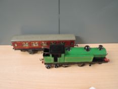 A Hornby 0 Gauge Clockwork 4-4-4 Loco having been repainted along with a Hornby tin plate LMS