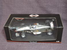 A Minichamps 1:18 scale diecast, Mclaren F1 Racing Car, boxed