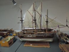 A wooden scale model of 1749 Royal Caroline British Royal Yacht, on wooden and brass display