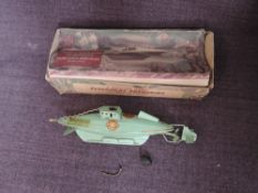 A Sutcliffe Model tin plate and clockwork model Submarine, Nautilus, with key, inner card display