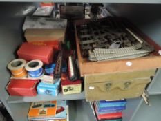 A shelf of 00 gauge and 0 gauge Track including Marklin, two 00 gauge Carriages, along with empty