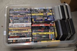 A box of assorted DVD's titles including 'Apocalypse of the Dead, Graffiti Rock, The Cars that Ate