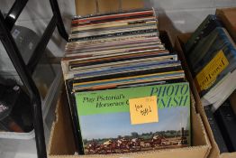 A box of one hundred mixed vinyl LP records, predominantly easy listening and classical.