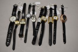 Ten ladies/girls fashion watches, all with black straps.