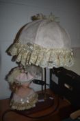 A kitch 1980's style lamp with porcelain bust of a lady to base.
