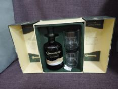 A bottle of Connemara Peated Single Malt Irish Whiskey, 70cl, 40% vol with two glasses in card