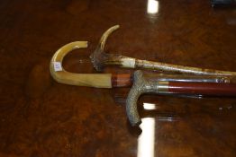 Three walking sticks 1 with antler top and one with horn crook