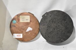 Two vintage cast dampers one tin has parchment inserts and the other is made of copper