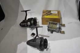 A Pluger Supreme reel with a box marked spares for pluger reel. a vintage shakespeare standard