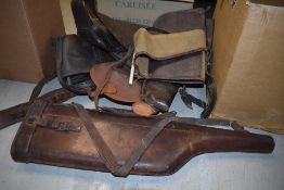 A box of assorted leather and canvas gunslips