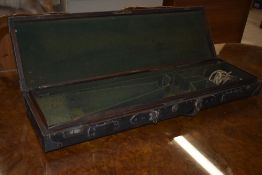A Leather fitted gun case with brass corners (carry handle broken, opening mechanism works but has