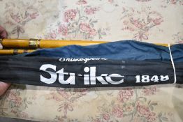 A Daiwa sensor carbon spin 3.05m, A Shakespeare strike 3.90m and a wooden boat rod
