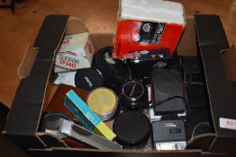 A box of various filters , flashes etc