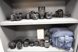 Four Samsung cameras and several lenses. Three Samsung NX20 cameras and a NX1100 camera with Samsung
