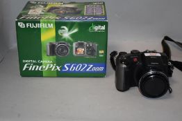 A Fujifilm Finepix S602 zoom digital camera with Super EBC Fujinon zoom lens in original box