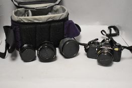 An Asahi Pentax MVI camera with Pentax-M 1:2,8 40mm lens, Tokina SD 28-70mm 1:3,5-4,5 lens, and