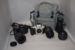 Two Canon cameras. An EOS50 and an EOS650 with Canon Zoom Ef35-70mm 1:3,5-4,5, a Centon Mirror